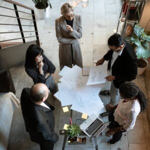 commercial negotiation A team of professionals engage in a business meeting in a sleek, modern office setting.